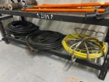 AIRE HOSE & ROLL OF FIBERGLASS FISH TAPE ON BOTTOM RACK SUPPORT EQUIPMENT