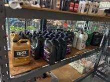 CONTENTS OF SHELF: ANTIFREEZE, ROTELLA 15W-40 MOTOR OIL, LUBRICATING OIL SUPPORT EQUIPMENT