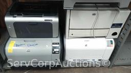 Lot on 9 Shelves of Computer Equipment: Monitors (Dell, Acer, HP, IBM, ViewSonic), Printers (Label