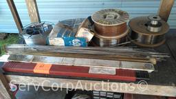 Lot on Shelf of Various Tigweld Rods & Wire Feeder Rolls