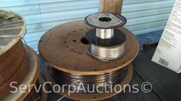 Lot on Shelf of Various Tigweld Rods & Wire Feeder Rolls