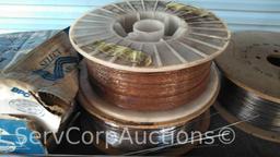 Lot on Shelf of Various Tigweld Rods & Wire Feeder Rolls