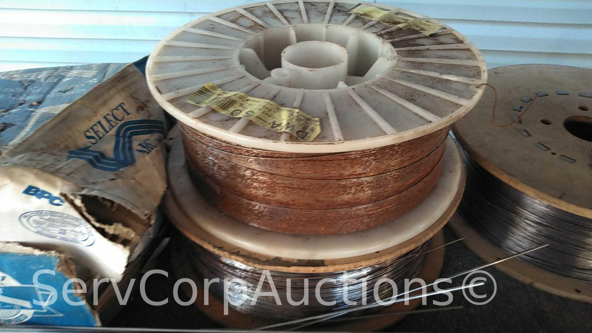 Lot on Shelf of Various Tigweld Rods & Wire Feeder Rolls