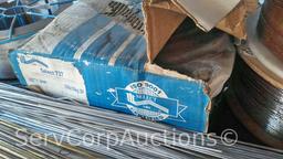Lot on Shelf of Various Tigweld Rods & Wire Feeder Rolls