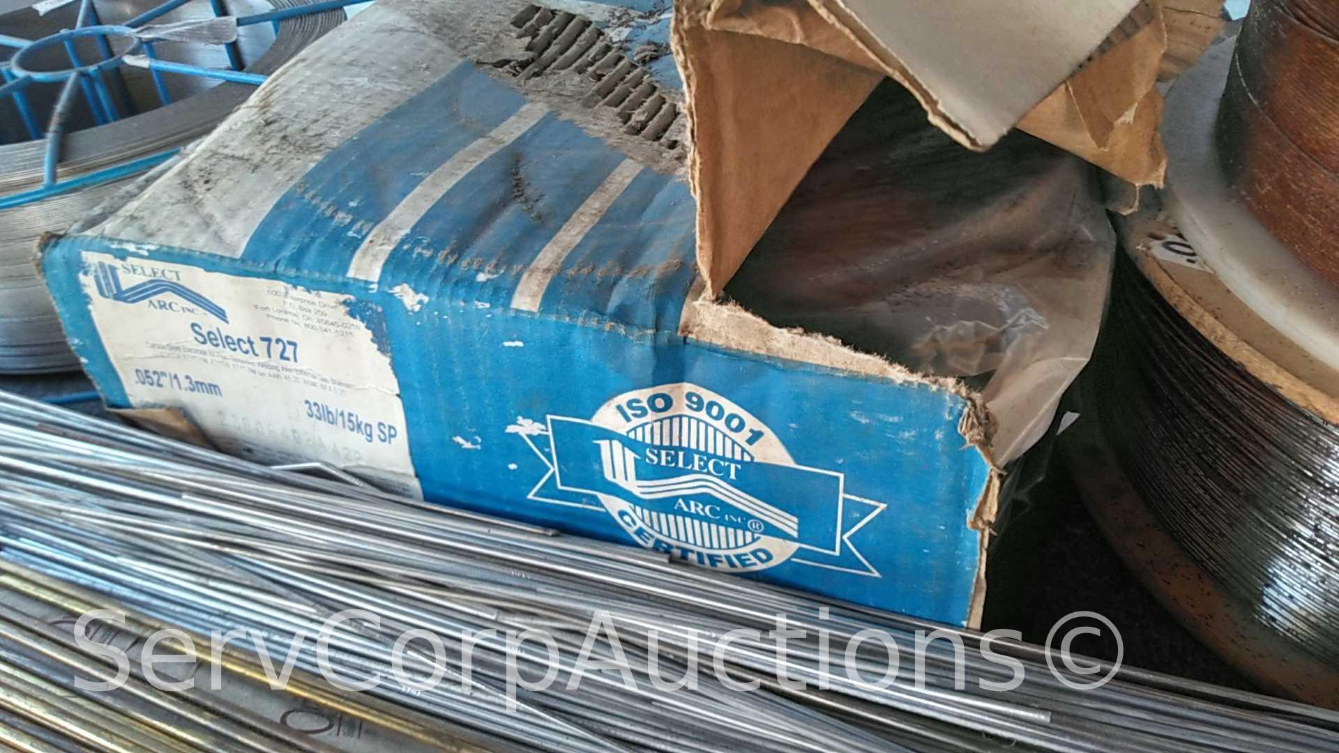 Lot on Shelf of Various Tigweld Rods & Wire Feeder Rolls