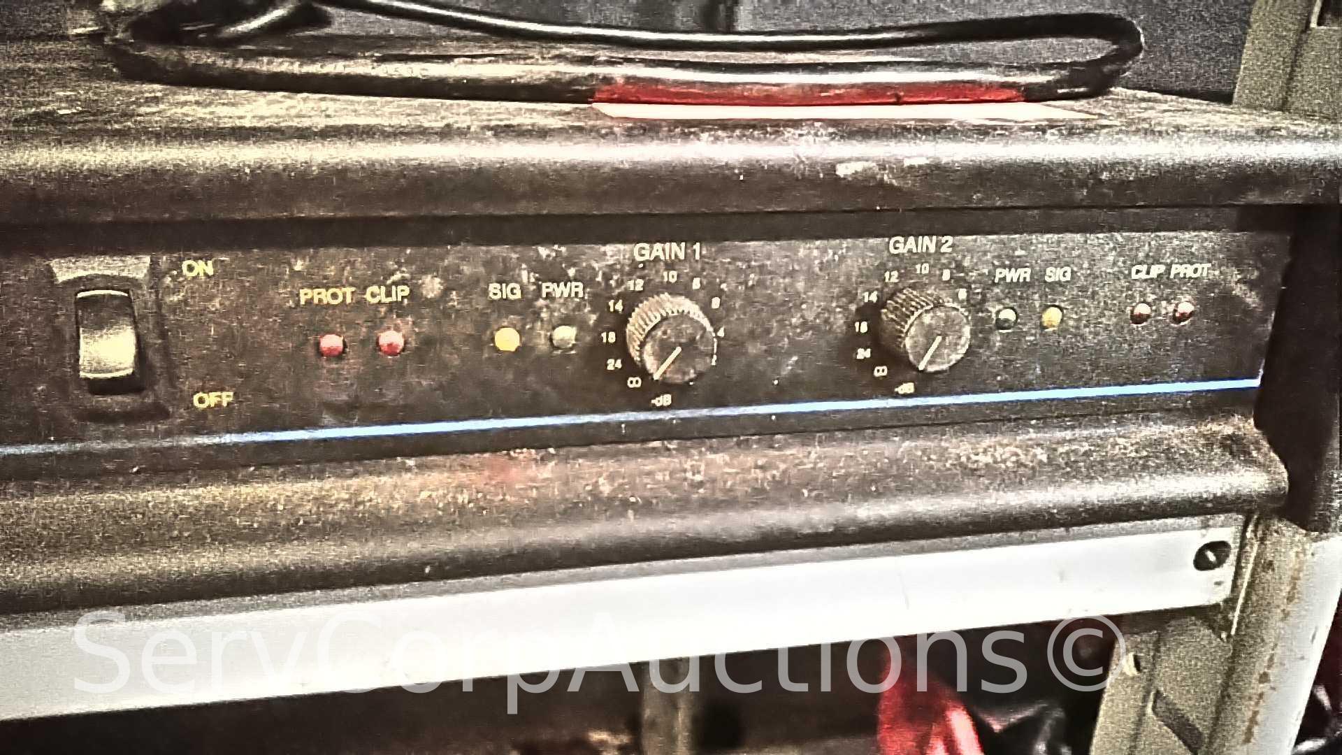 Lot on Shelf of QSC MX 1500A Professional Stereo Amplifier