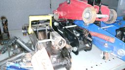 Lot on 2 Shelves of Various Floor Jacks, Bottle Jacks, Ball Mount Hitches, Jack Stands, 4-Ways, Lug