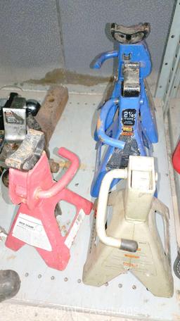 Lot on 2 Shelves of Various Floor Jacks, Bottle Jacks, Ball Mount Hitches, Jack Stands, 4-Ways, Lug