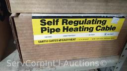 Lot on Shelves of Various Pipe Heating Cables, Ice Cream Makers, Bird Houses, Heating Pads, Dog