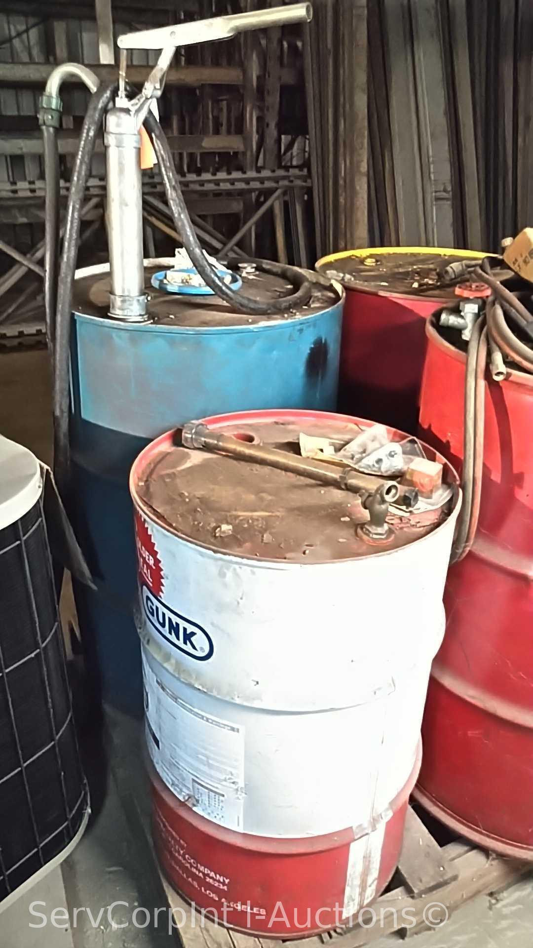 Lot on Pallet of Various Oil Drums, Oil Pump, Torch Hoses with Gauges