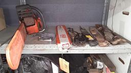 Lot on Shelf of Husqvarna Chainsaw, Various Chainsaw Bars, Chainsaw Chains, Lawnmower Blades