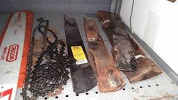 Lot on Shelf of Husqvarna Chainsaw, Various Chainsaw Bars, Chainsaw Chains, Lawnmower Blades