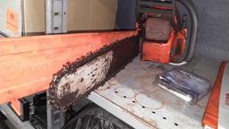 Lot on Shelf of Husqvarna Chainsaw, Various Chainsaw Bars, Chainsaw Chains, Lawnmower Blades