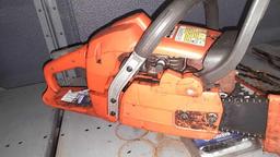 Lot on Shelf of Husqvarna Chainsaw, Various Chainsaw Bars, Chainsaw Chains, Lawnmower Blades