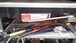 Lot on Shelf of Various Machetes, Paint Mixers, Loppers, Pick Axe, Shingle Shovel, Miter Box, Edge