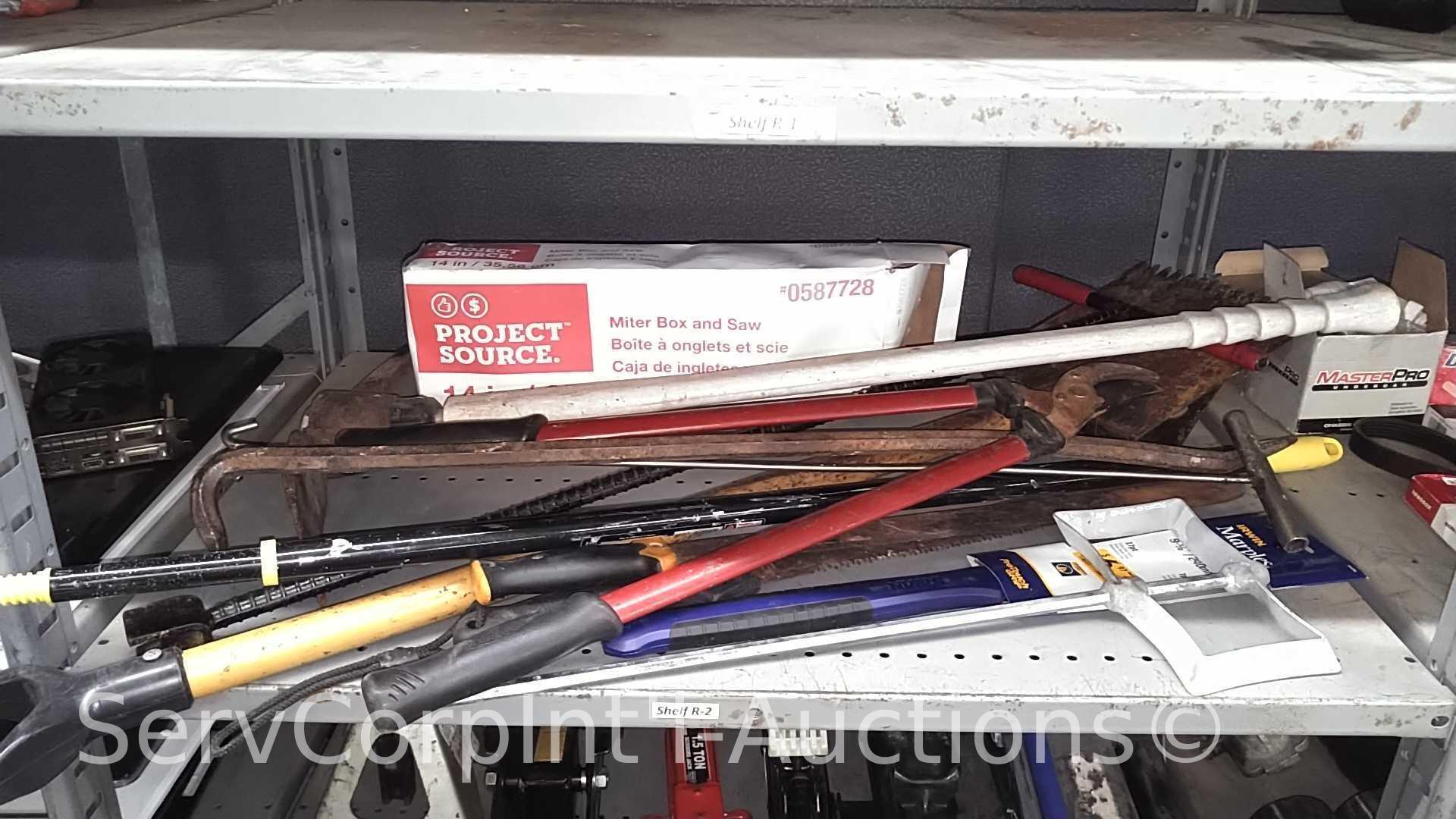 Lot on Shelf of Various Machetes, Paint Mixers, Loppers, Pick Axe, Shingle Shovel, Miter Box, Edge