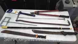 Lot on Shelf of Various Machetes, Paint Mixers, Loppers, Pick Axe, Shingle Shovel, Miter Box, Edge