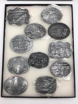 Collection of 11 Hesston Belt Buckles