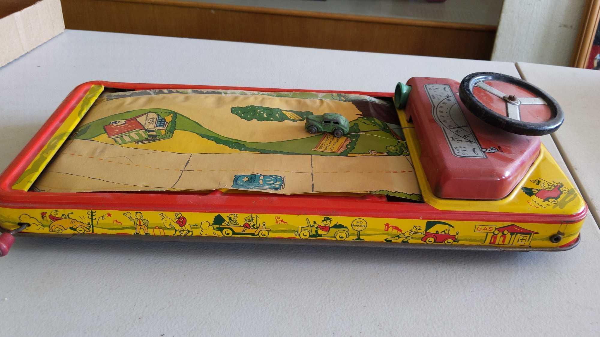 Crank Action Tin Driving Game - Scroll Ripped & Horn Missing