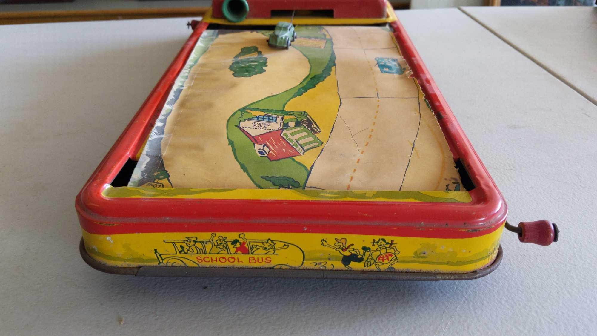 Crank Action Tin Driving Game - Scroll Ripped & Horn Missing