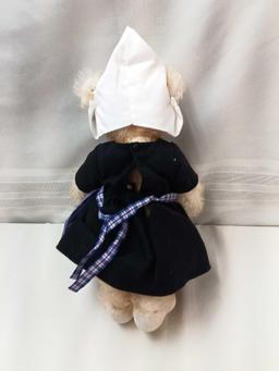 STIEFF BEAR. BUFF COLOR 12" DRESSED IN HOLLAND STYLE DRESS, CAP, AND WOODEN SHOES