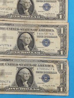 FIVE 1957B ONE DOLLAR SILVER CERTIFICATES