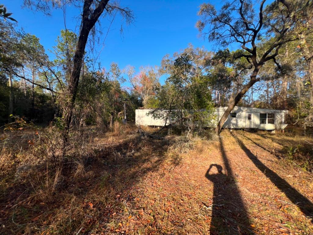 4.37 acre lot with Old Mobile Home - Archer, FL