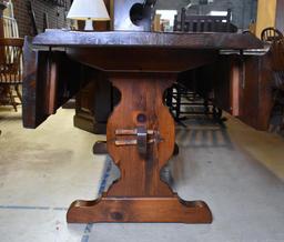 Vintage Dark Stained Knotty Pine Drop Leaf Trestle Dining Table