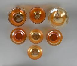 Lot of Seven Small Marigold Carnival Glass Bowls of Various Patterns & Makers