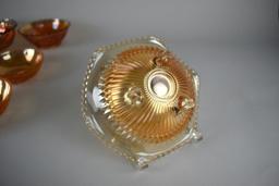 Lot of Seven Small Marigold Carnival Glass Bowls of Various Patterns & Makers