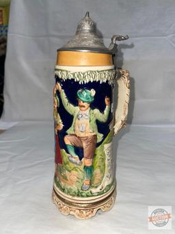 German musical stein with lid, 11"h, embossed motif, does not work