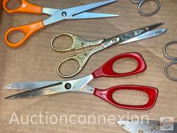 10 items - 9 Scissors and 1 Knife