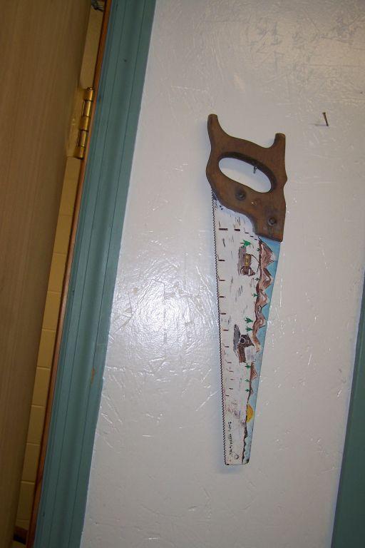 PAINTED HAND SAW (2) AND HORSESHOE