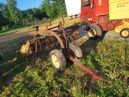 NEW HOLLAND 256 HAY RAKE WITH DOLLY WHEELS