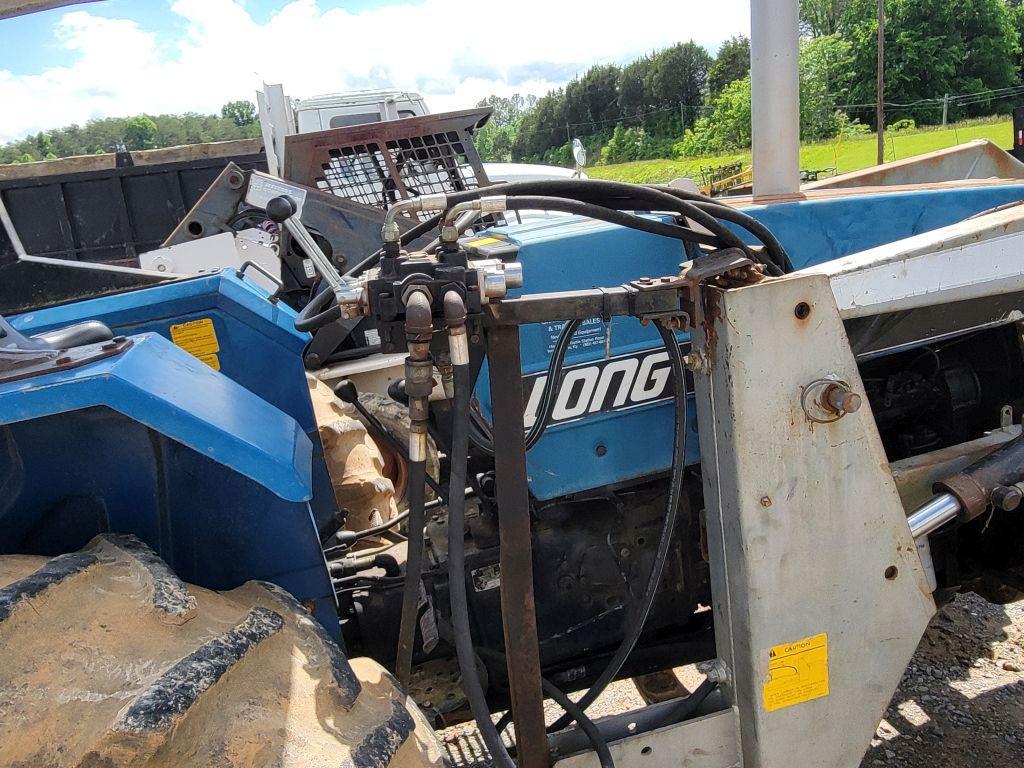 LONG 2610 TRACTOR W/ LONG FRONT END LOADER AND 6' BUCKET, 4WD, 2365 HOURS SHOWING, RUNS/DRIVES,