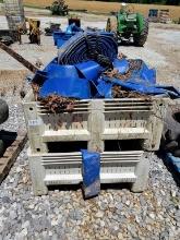 2 CRATES STACKED OF 6" HOSE APPROX. 12 ROLLS