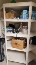 CONTENT ON 4 TIER SHELF CONSISTING OF DOZENS OF GOLF BALLS