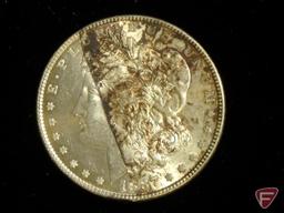 1887 Morgan Silver Dollar uncirculated, splotchy brown toning