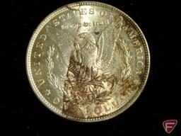 1887 Morgan Silver Dollar uncirculated, splotchy brown toning