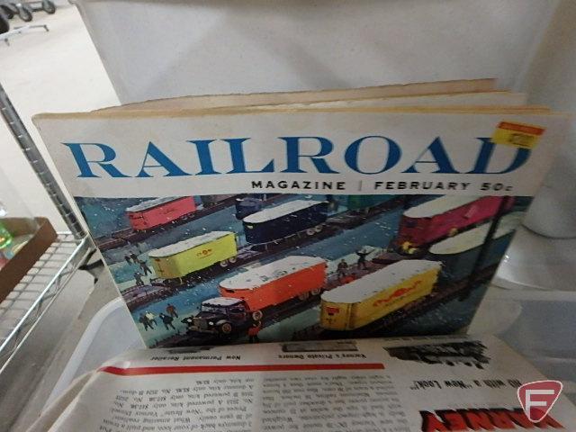Train set, some Northern Pacific cars, tracks, transformer, and railroad books