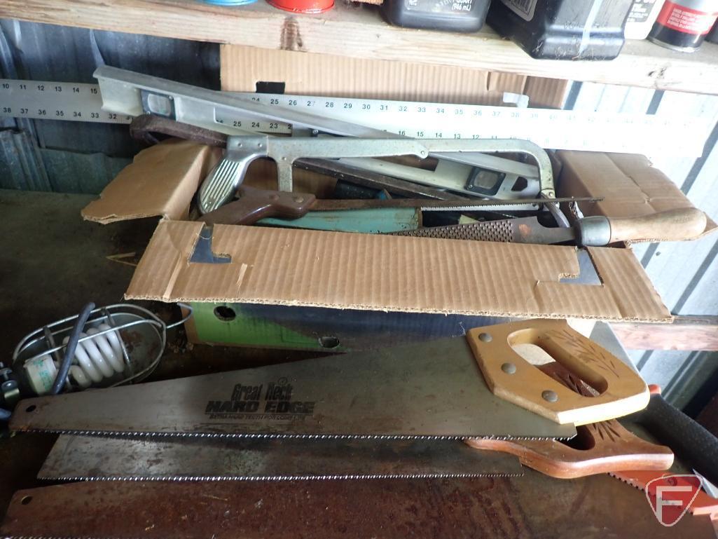 Hand tools: saws, level, sockets, wrenches, rivet tool, trouble light, hammer.