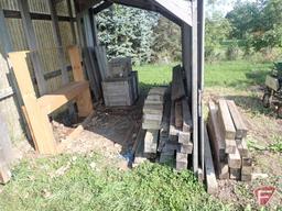 Contents of shed; lumber, bricks, wood crates, wood shelf, wood fence panels, plastic pallets