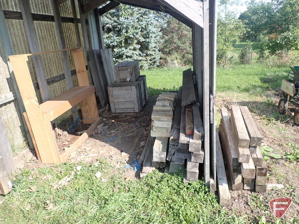 Contents of shed; lumber, bricks, wood crates, wood shelf, wood fence panels, plastic pallets