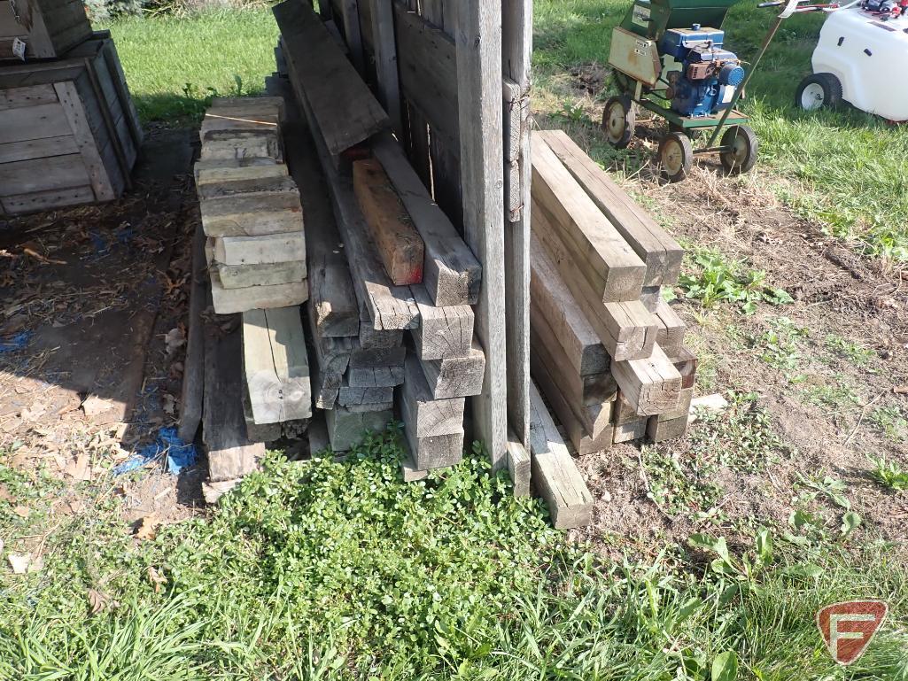 Contents of shed; lumber, bricks, wood crates, wood shelf, wood fence panels, plastic pallets