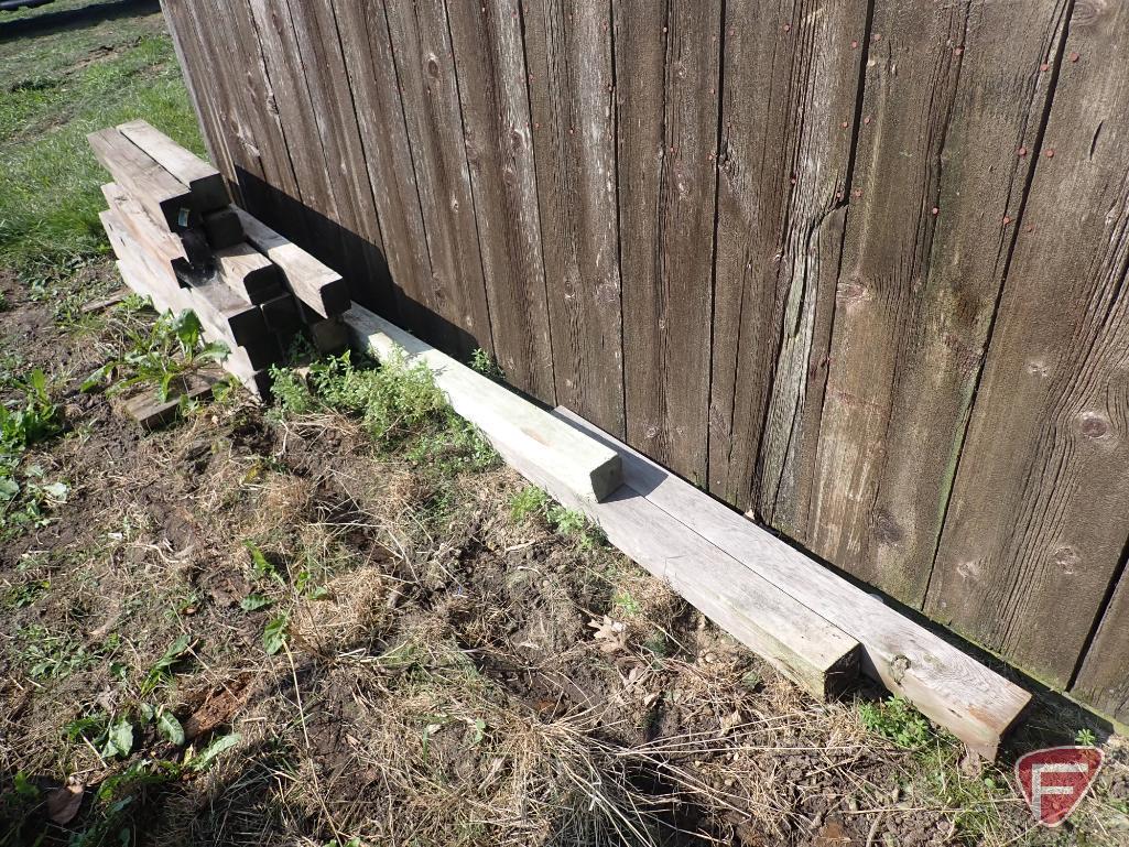 Contents of shed; lumber, bricks, wood crates, wood shelf, wood fence panels, plastic pallets