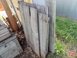Contents of shed; lumber, bricks, wood crates, wood shelf, wood fence panels, plastic pallets