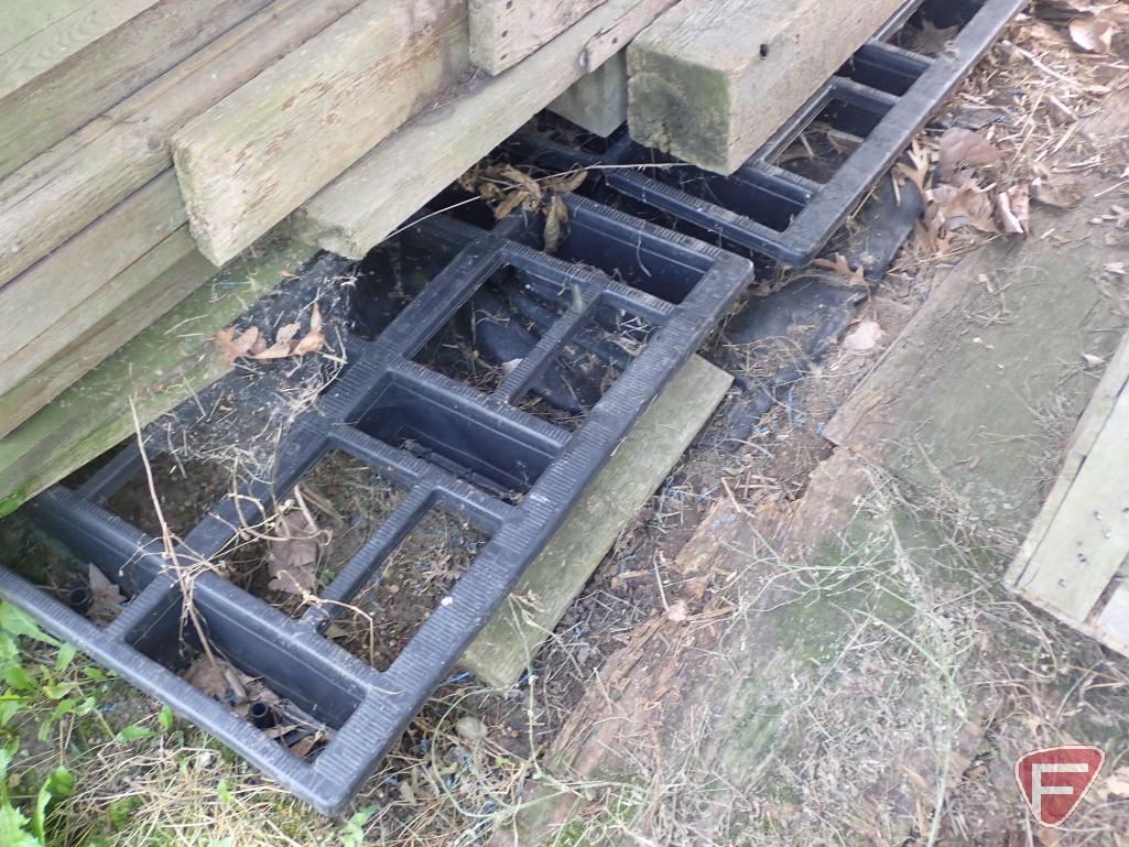 Contents of shed; lumber, bricks, wood crates, wood shelf, wood fence panels, plastic pallets