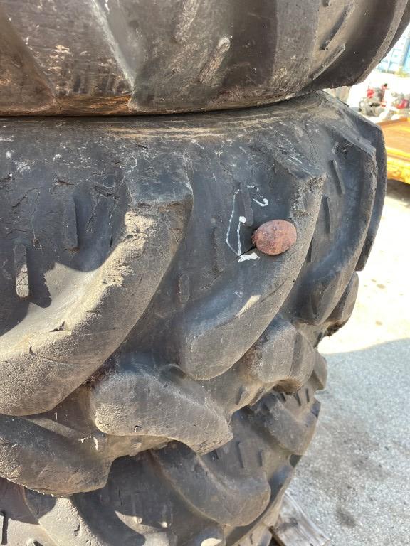 (4) Tires 16.9X24 and rims, Pnuematic, fits  JCB 4CX RTB, See pic on spike