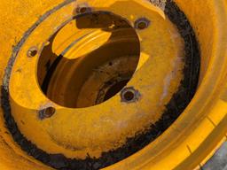 (4) Tires 16.9X24 and rims, Pnuematic, fits  JCB 4CX RTB, See pic on spike