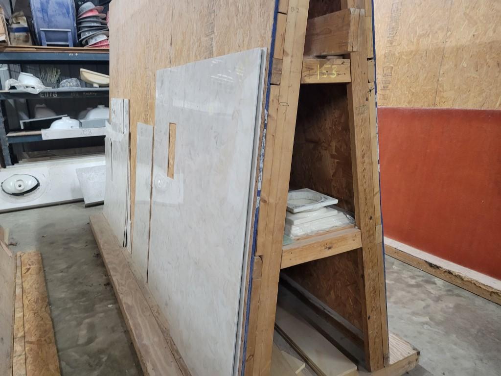 (2) WOODEN A-FRAME RACKS WITH CONTENTS.  GLASS, SHOWER CURB MOLD, MARBLE PI